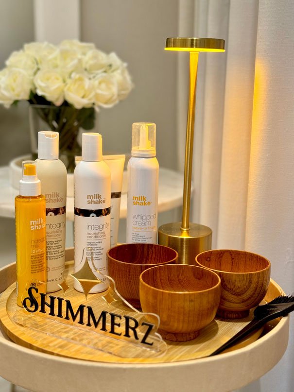 Shimmerz tray with hair care products and wooden bowls