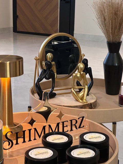 Shimmerz nail polish cart beside a decorative mirror